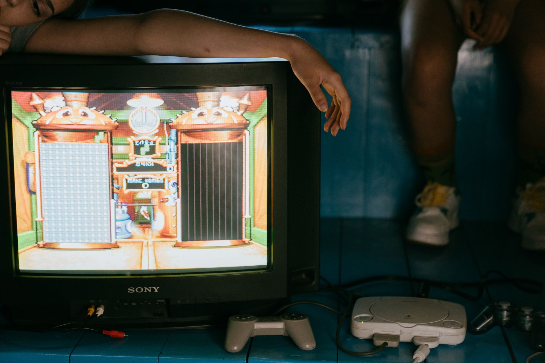 Gamer analyzing a retro controller gameplay setup